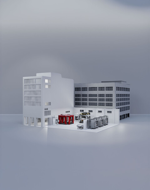 Modell eines Fabrikgebäudes mit Produktionsbereich und mehreren Maschinen als Symbol für moderne Fertigung.